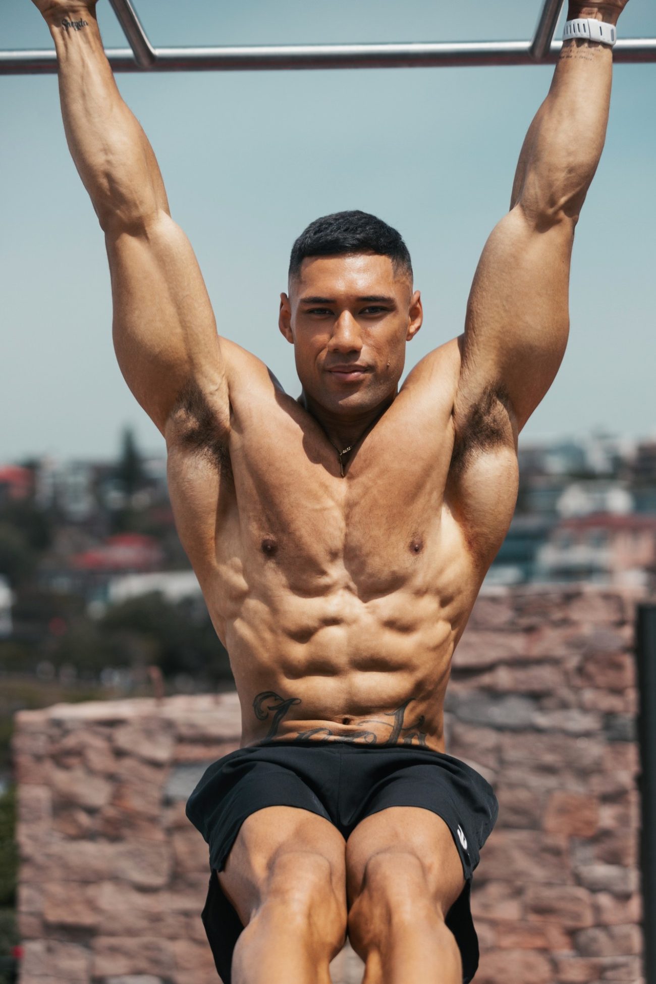 Giovanni Leota hanging from the bars at Bondi